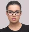 Black Gucci GG0025O Rectangle Glasses - Modelled by a female