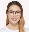 Transparent Grey Ray-Ban RB7046-51 Round Glasses - Modelled by a female