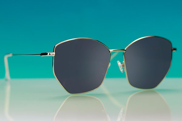 Angular pair of sunglasses on a blue background