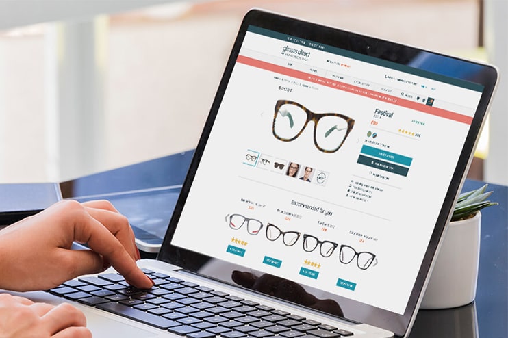 Buying glasses online on a laptop
