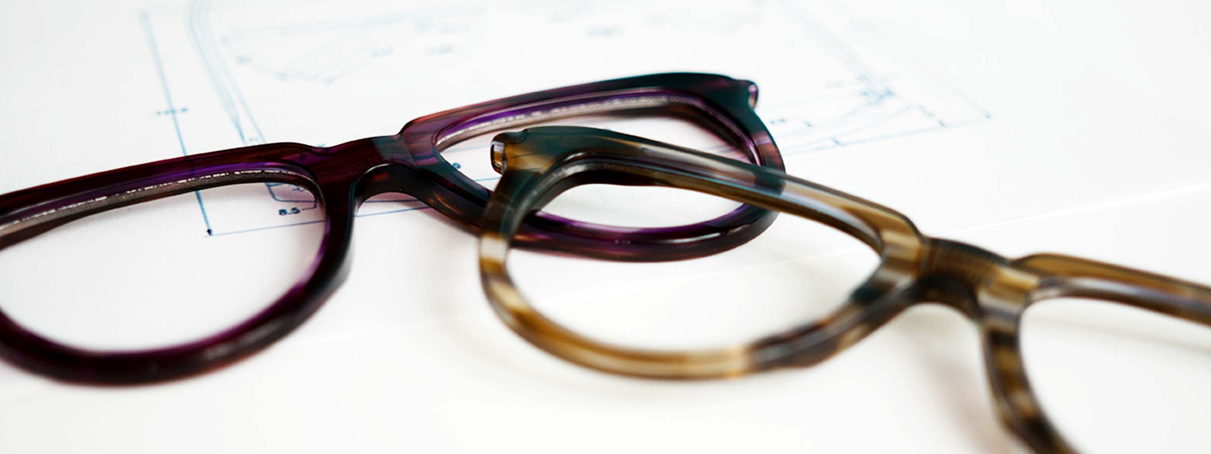 Glasses frame parts lying on a design sheet
