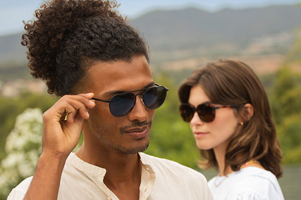 Man and woman wearing sunglasses outdoors