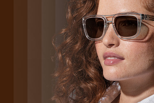 Woman wearing Transitions Transitions®XTRActive® lenses