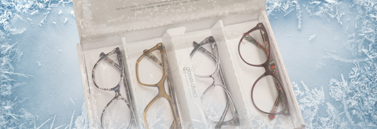 Four glasses frames in a Glasses Direct Home Trial box surrounded by ice flowers