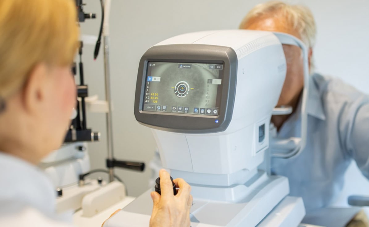 Man with cataracts having an eye test