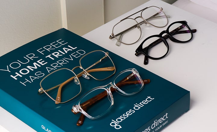 Glasses Direct home trial box with four frames on a side table