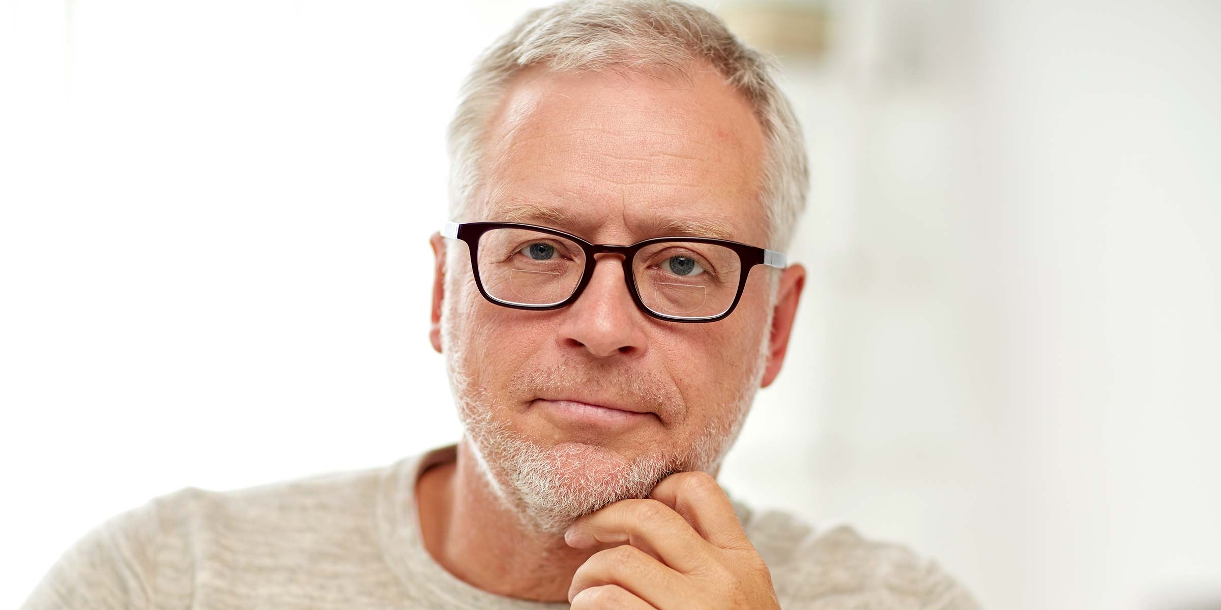 Middle-aged man wearing glasses with bifocal lenses