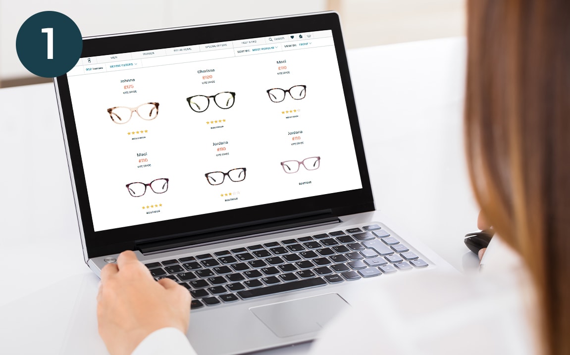 A woman browsing the Glasses Direct website on a laptop