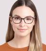 Brown / Gold Aspire Anika Oval Glasses - Modelled by a female