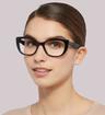 Black / Transparent Grey Dolce & Gabbana DG3360 Cat-eye Glasses - Modelled by a female