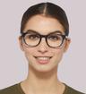 Tanzanite Glasses Direct Andi Birthstone Round Glasses - Modelled by a female
