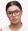 Matte Crystal Khaki Glasses Direct Harquin Round Glasses - Modelled by a female