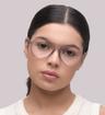 Matte Crystal Light Grey Glasses Direct Harquin Round Glasses - Modelled by a female