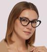 Black/Black Transparent Gucci GG1013O Cat-eye Glasses - Modelled by a female
