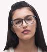 Grey Perri Kiely x LR ZEROTHREE Round Glasses - Modelled by a female