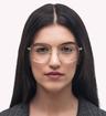 Gold Persol PO1007V Oval Glasses - Modelled by a female