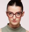 Burgundy Polaroid PLD D504 Cat-eye Glasses - Modelled by a female