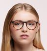 Rubber Havana Ray-Ban RB7046-51 Round Glasses - Modelled by a female