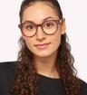 Solid Brown Scout Emelia Round Glasses - Modelled by a female